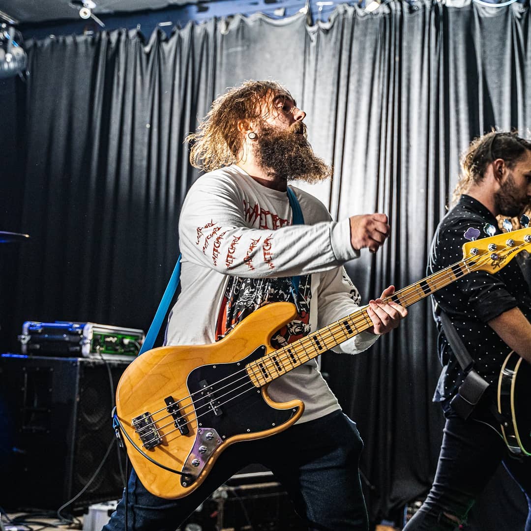 a Photo of me playing bass at a gig, when I still had hair